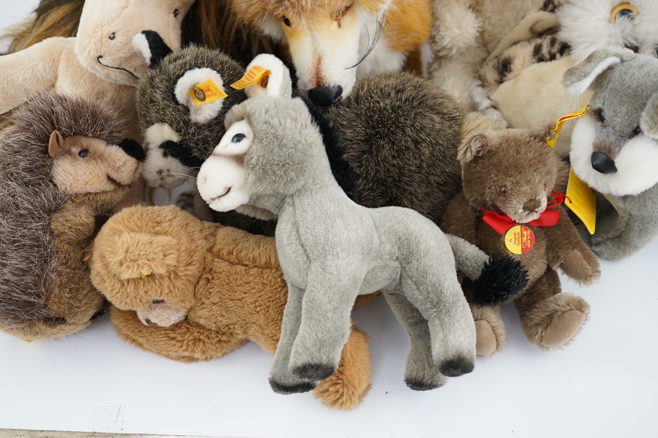 Nine assorted yellow tag Steiff animals, one Yorkshire Terrier, Steiff china plate, one yellow tag bear (12)